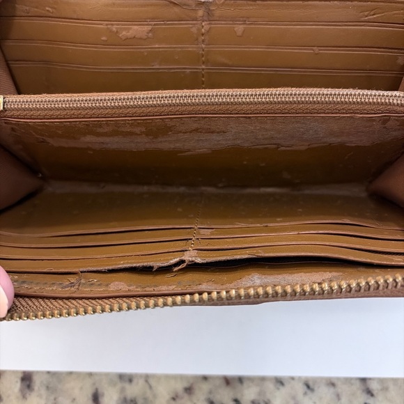 Coach Tan and Brown Signature Zip Wallet
PROJECT - Picture 5 of 9